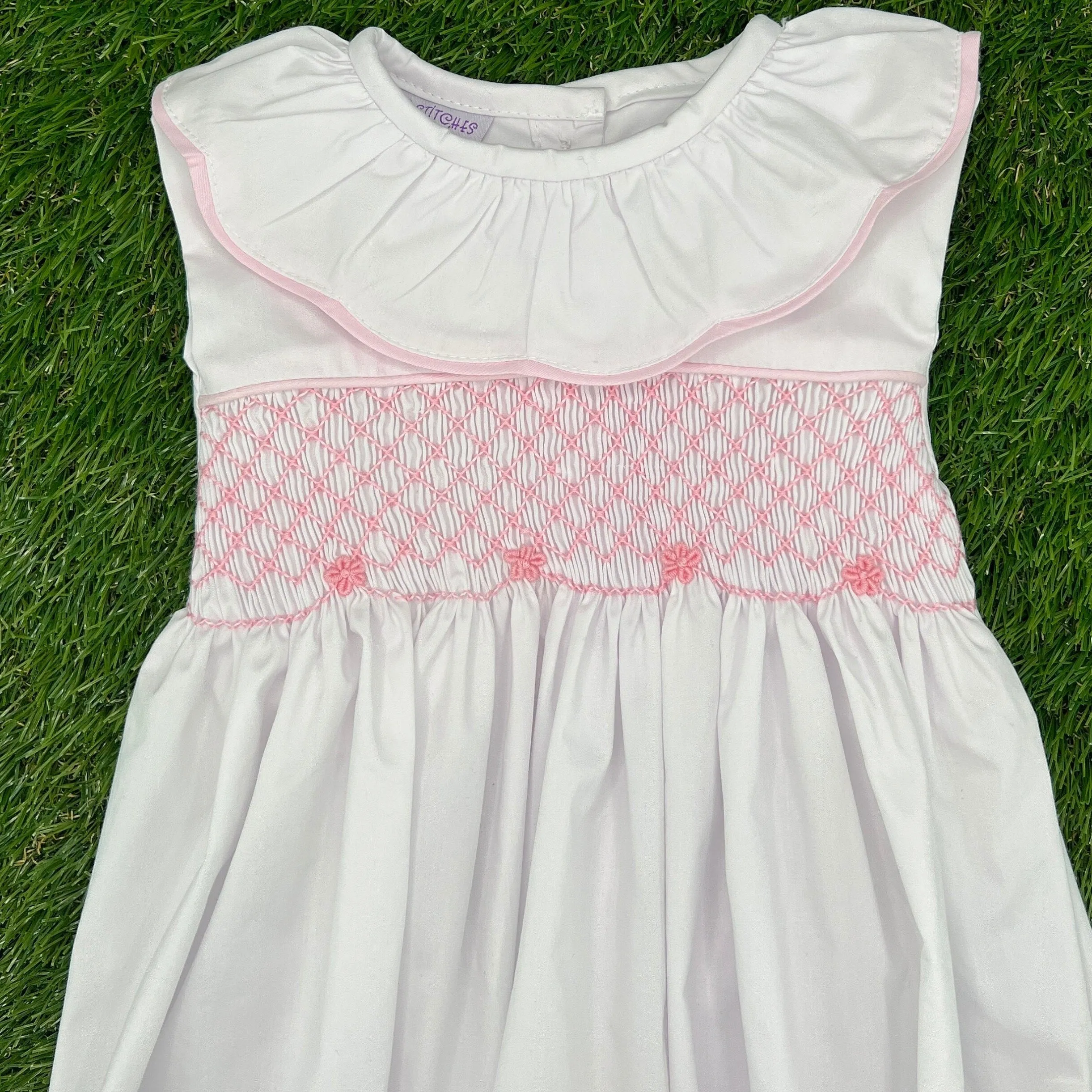 Smocked Toulouse Romper in White with Pink Ruffle Collar